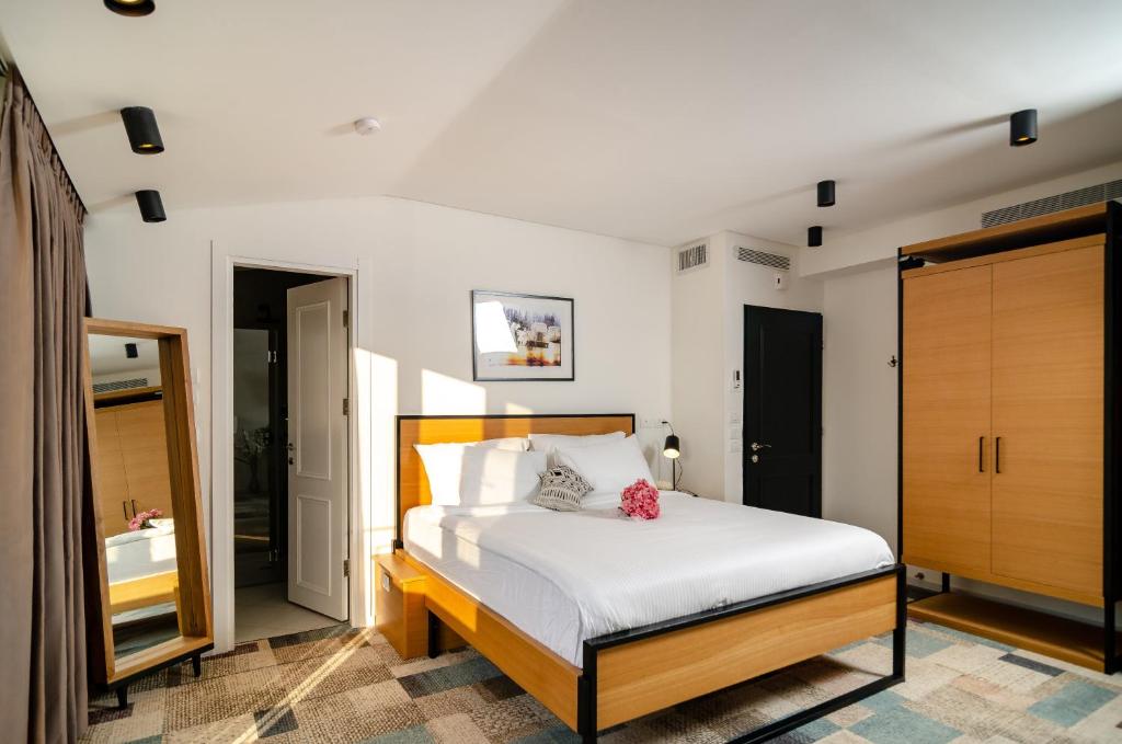 Postel nebo postele na pokoji v ubytování Biazi Hotel