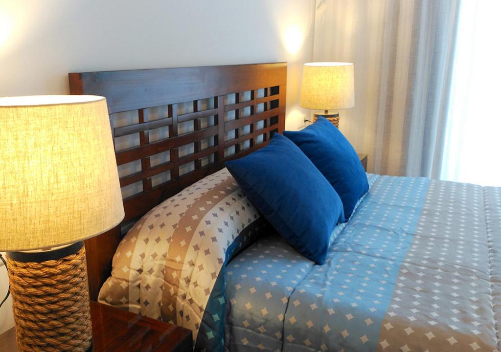 Postel nebo postele na pokoji v ubytování Cangas Popa