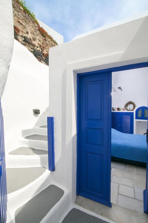 Postel nebo postele na pokoji v ubytování Ifestio Villas Oia
