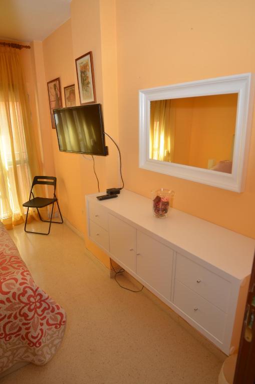 Televízia a/alebo spoločenská miestnosť v ubytovaní habitacion centro historico malaga