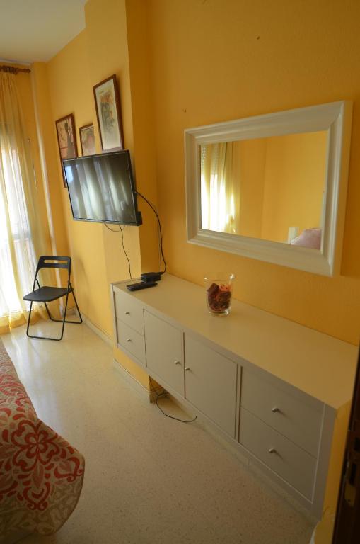 Televízia a/alebo spoločenská miestnosť v ubytovaní habitacion centro historico malaga