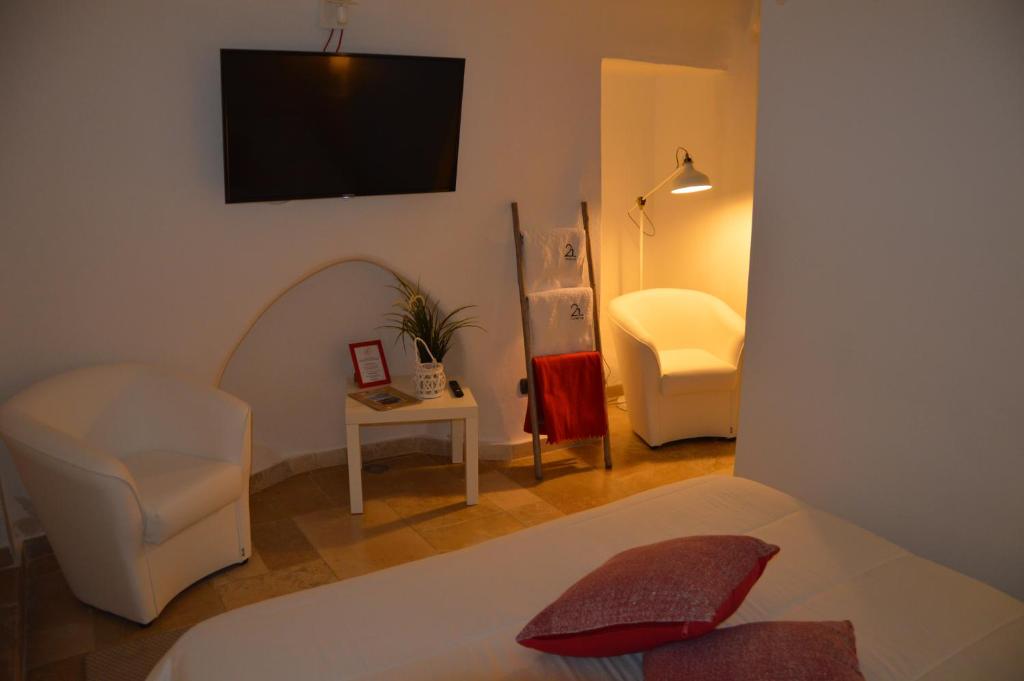 Postel nebo postele na pokoji v ubytování 21mq Suite Homes Ostuni