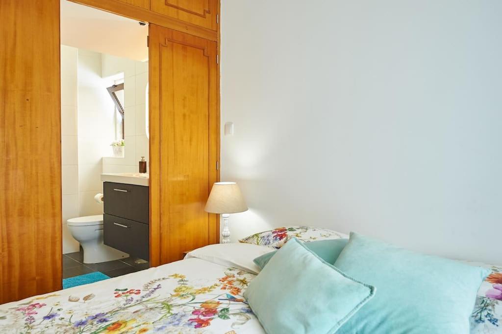 Postel nebo postele na pokoji v ubytování Beija-Flor House