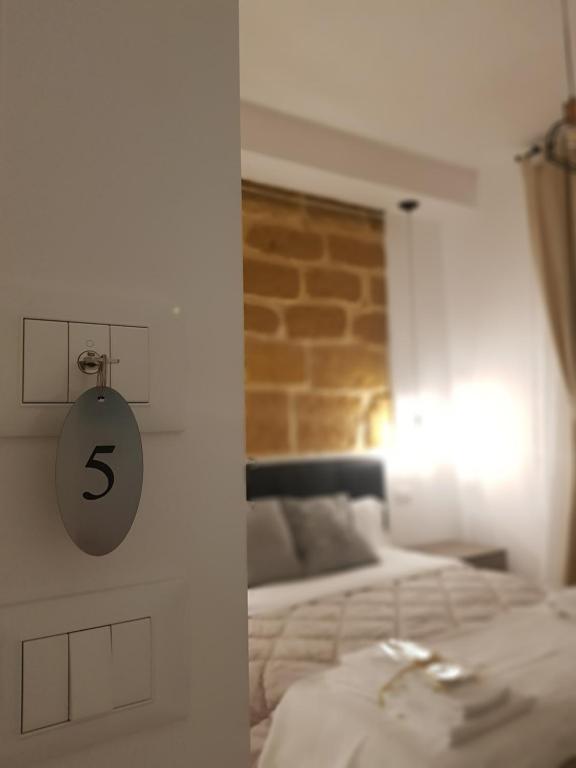 Postel nebo postele na pokoji v ubytování Gocce di Girgenti - comfort suites