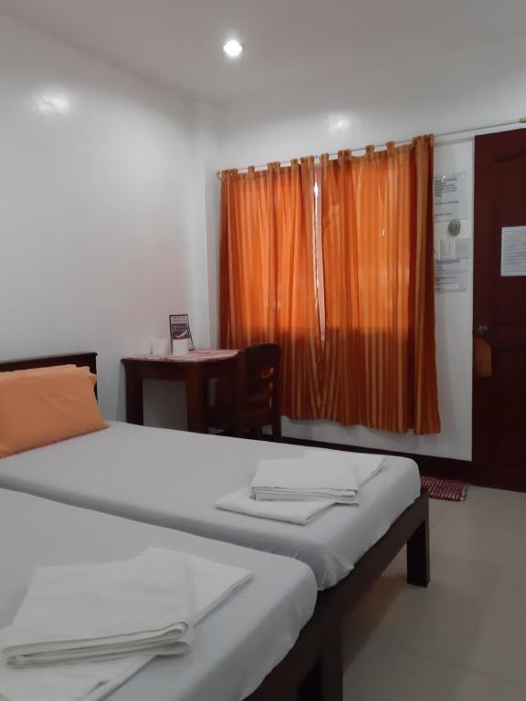 Letto o letti in una camera di SLAM'S Garden Dive Resort