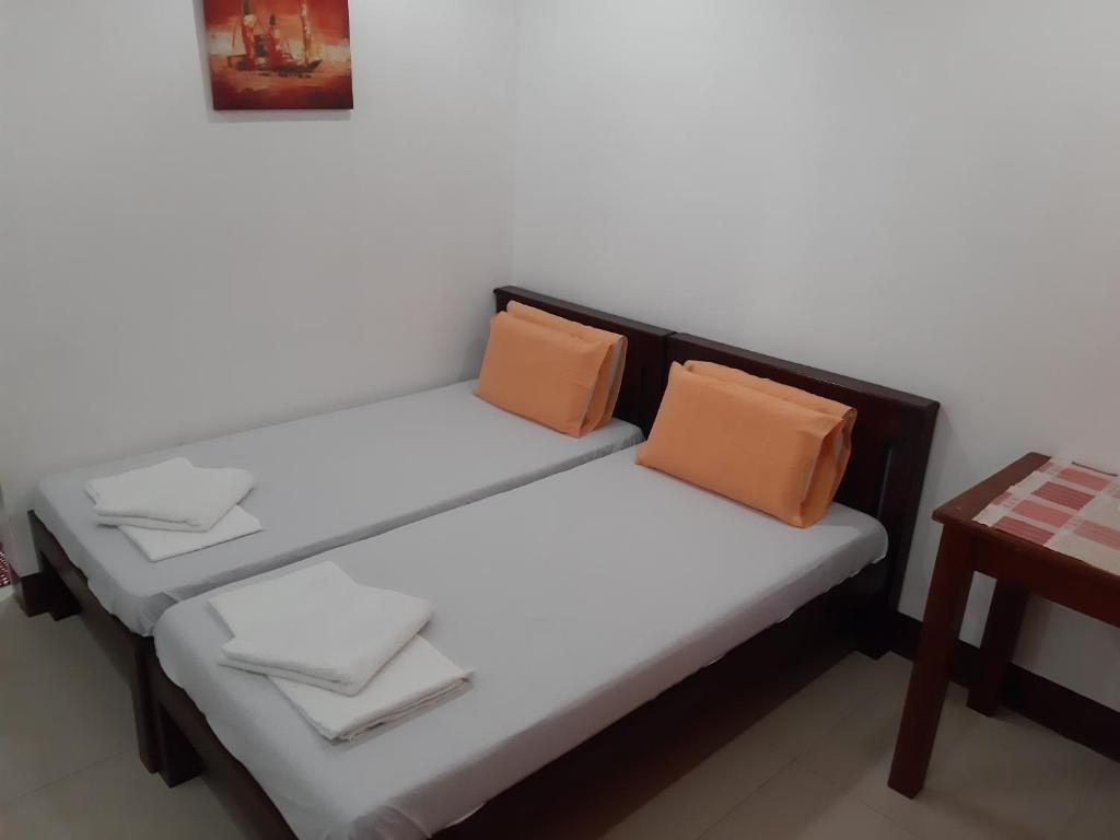 Letto o letti in una camera di SLAM'S Garden Dive Resort