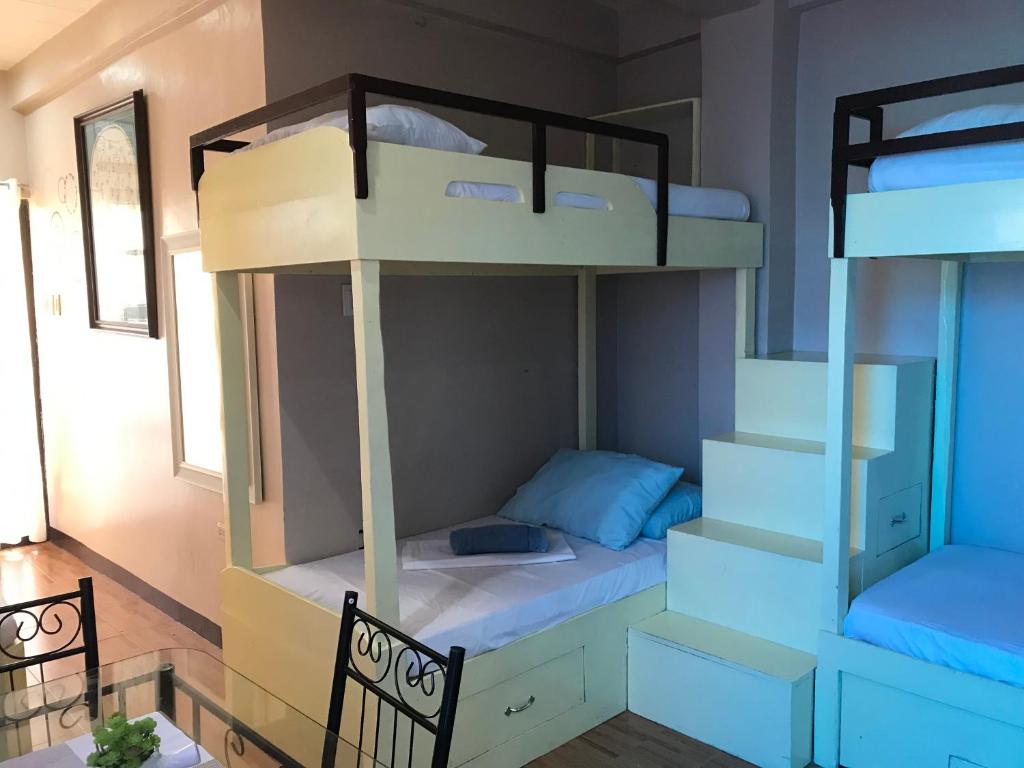 Postel nebo postele na pokoji v ubytování Palompon lodge