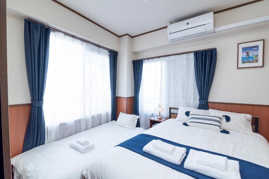 Postel nebo postele na pokoji v ubytování Uhome Iriya Apartment