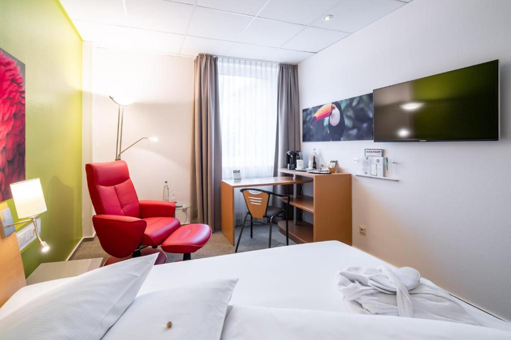 TV a/nebo společenská místnost v ubytování Anders Hotel Walsrode