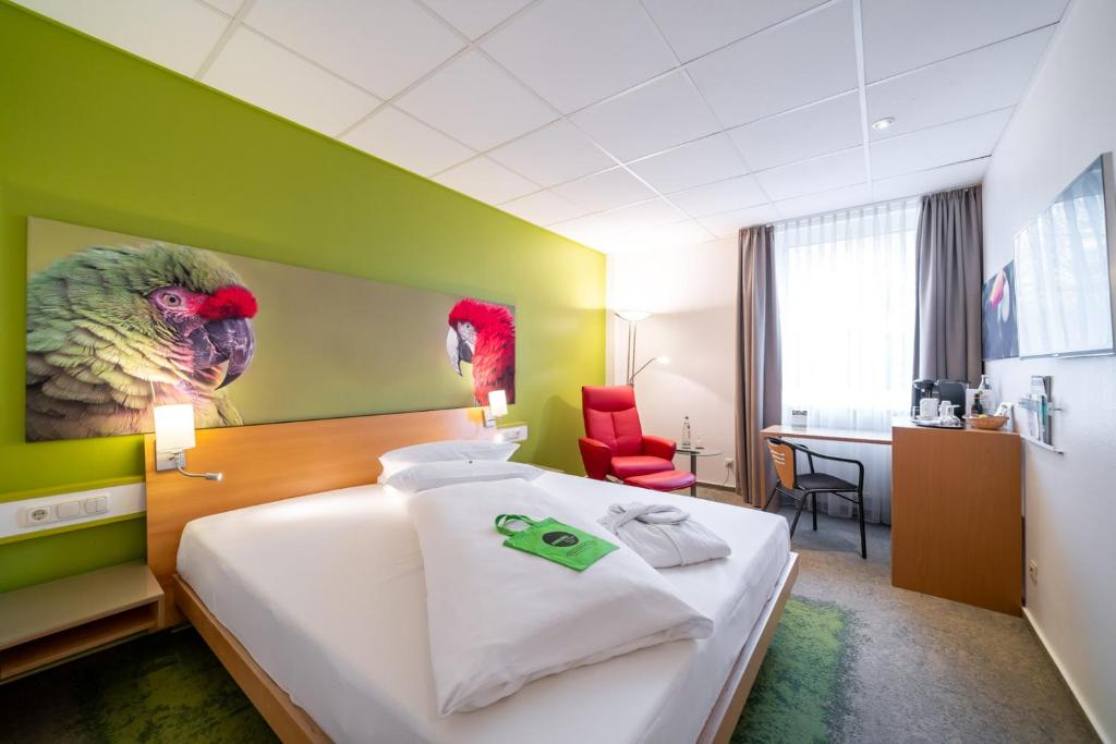 Postel nebo postele na pokoji v ubytování Anders Hotel Walsrode