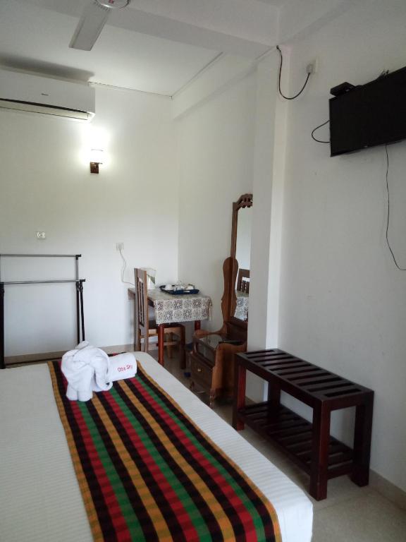 Postel nebo postele na pokoji v ubytování Otha Shy Airport Transit Hotel