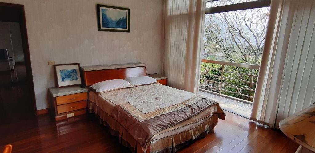Postel nebo postele na pokoji v ubytování Ri Jing Yuan Homestay