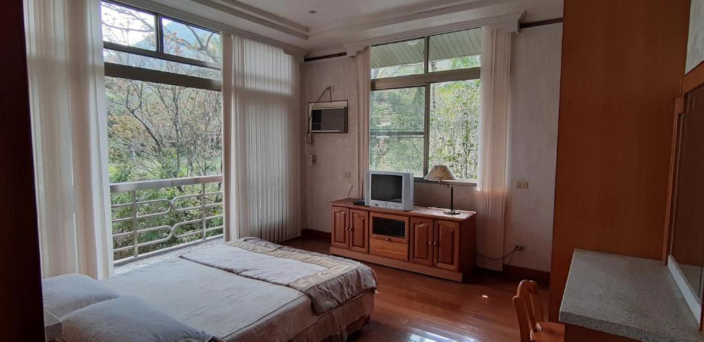 Postel nebo postele na pokoji v ubytování Ri Jing Yuan Homestay