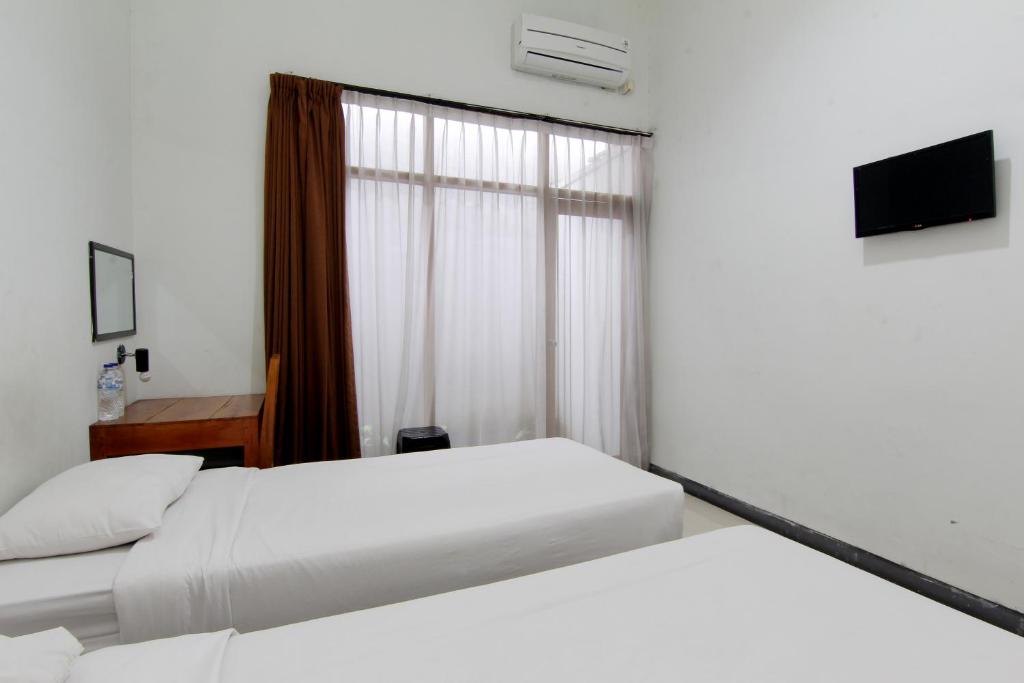 Postel nebo postele na pokoji v ubytování The Fort Hotel
