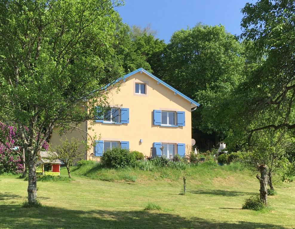 a house in the middle of a field with trees at La Mésange bleue in Saint-Barthélemy