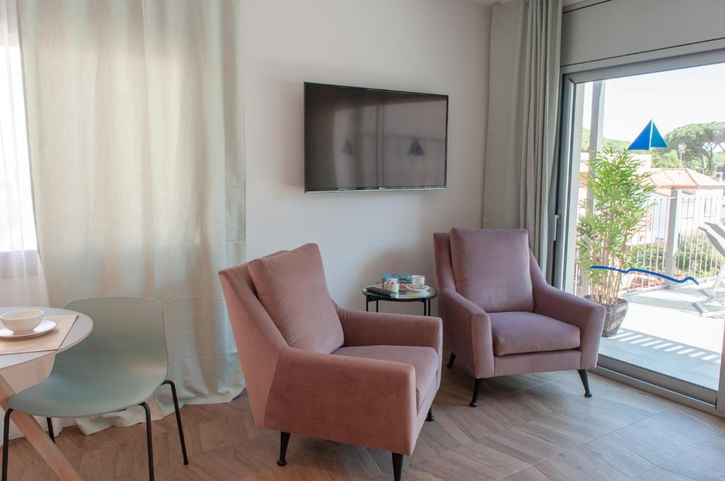 TV a/nebo společenská místnost v ubytování Apartamentos Porta Coeli