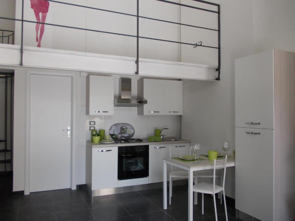 Kuchnia lub aneks kuchenny w obiekcie Loft Regio Parco