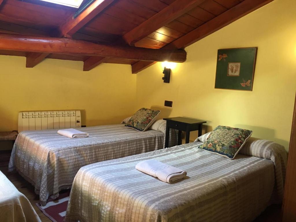 Postel nebo postele na pokoji v ubytování Casa Rural EL RINCÓN DE LA MORAÑA