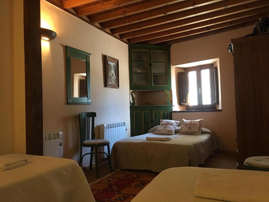 Postel nebo postele na pokoji v ubytování Casa Rural EL RINCÓN DE LA MORAÑA