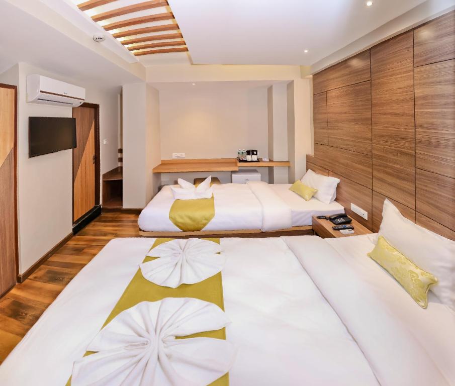 Postel nebo postele na pokoji v ubytování Hotel Bihani