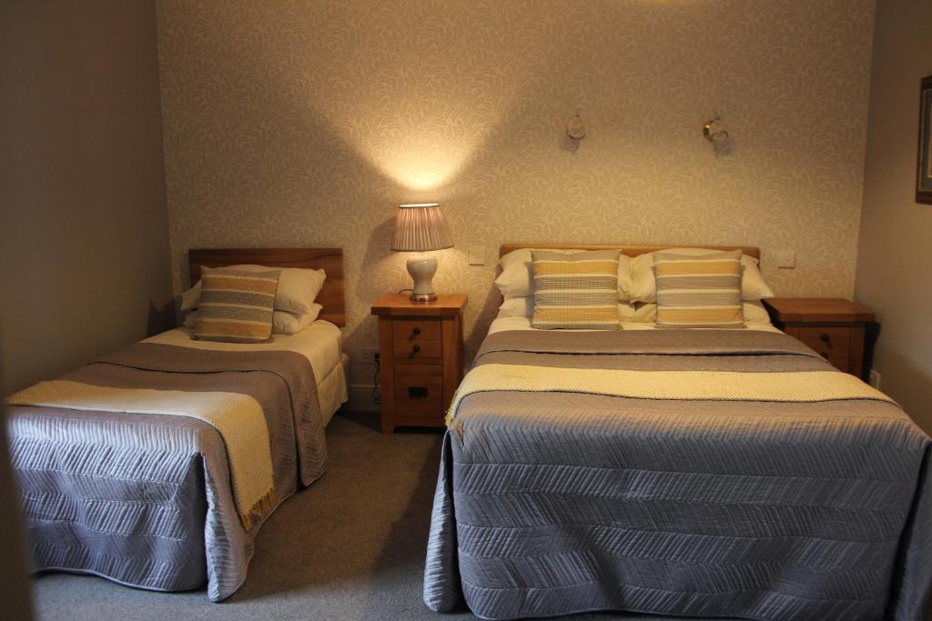 Postel nebo postele na pokoji v ubytování Grey Gables Farmhouse B&B