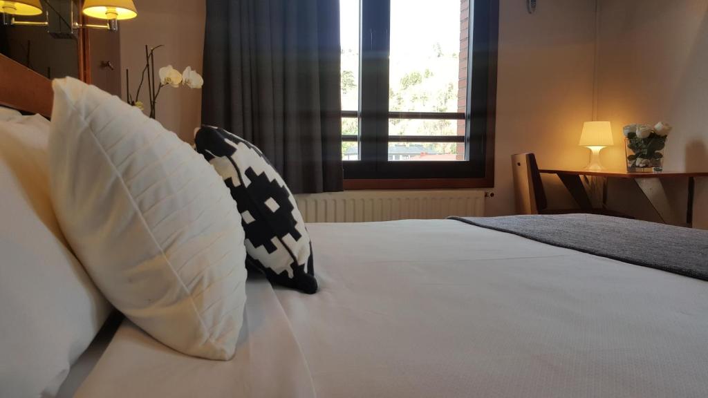 Postel nebo postele na pokoji v ubytování Hotel Oria