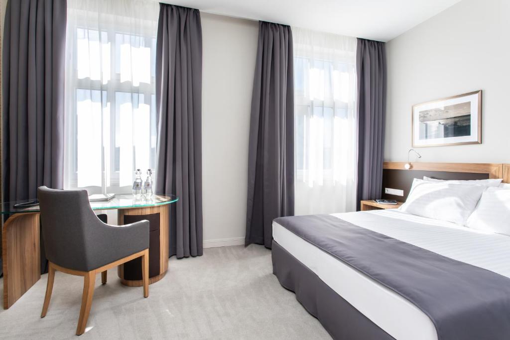 Postel nebo postele na pokoji v ubytování Jakubowy Hotel