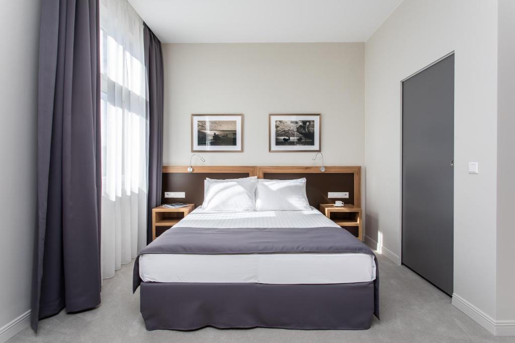 Postel nebo postele na pokoji v ubytování Jakubowy Hotel