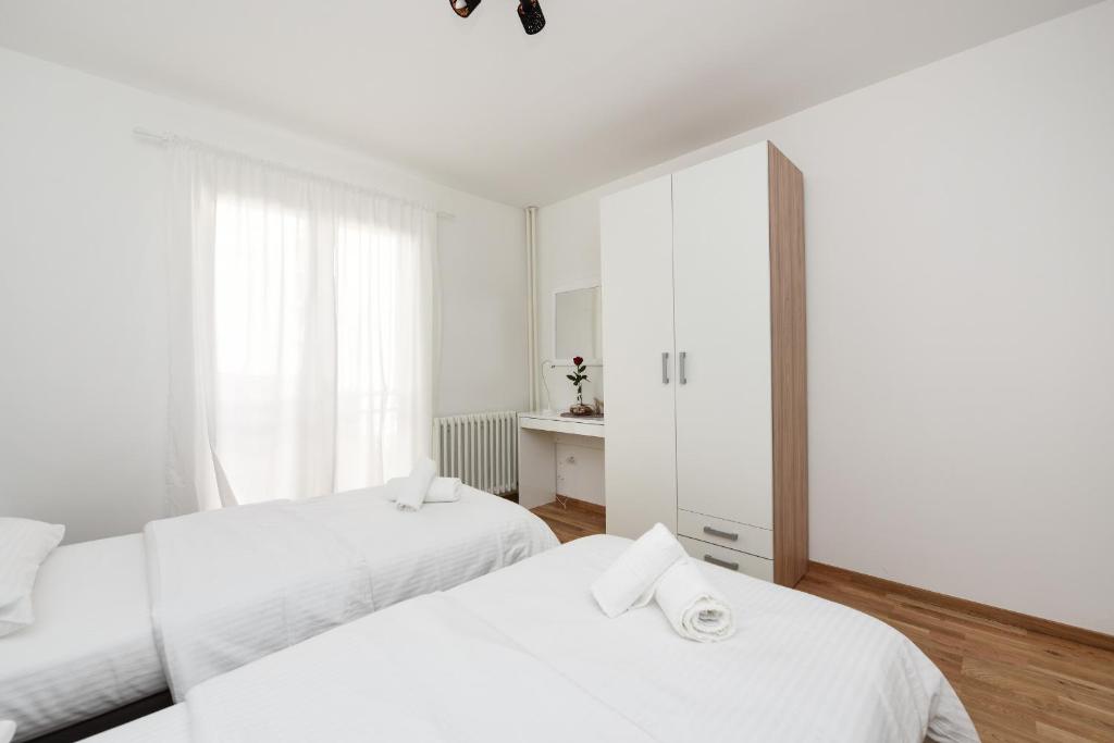 Posteľ alebo postele v izbe v ubytovaní July Apartment