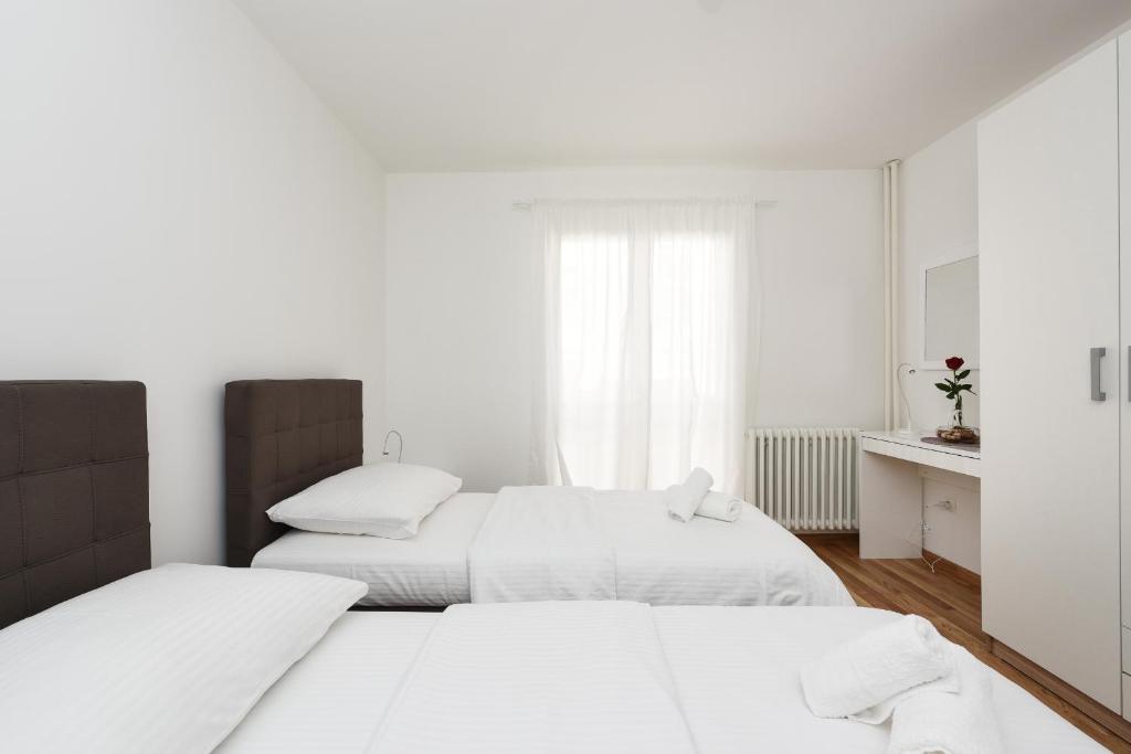 Posteľ alebo postele v izbe v ubytovaní July Apartment
