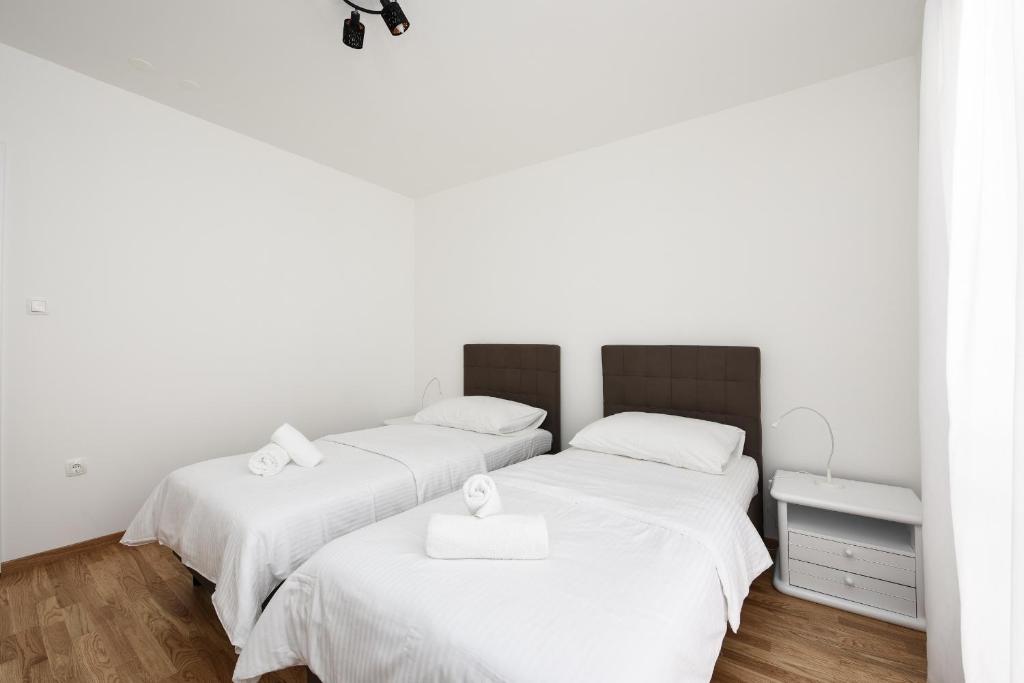 Posteľ alebo postele v izbe v ubytovaní July Apartment