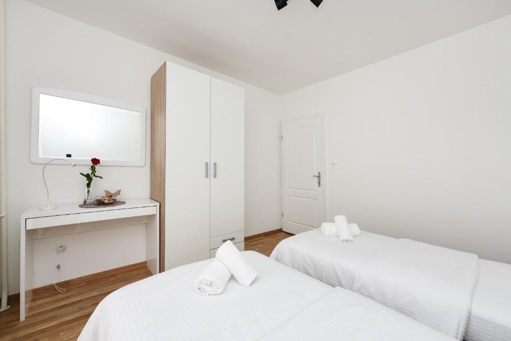 Posteľ alebo postele v izbe v ubytovaní July Apartment