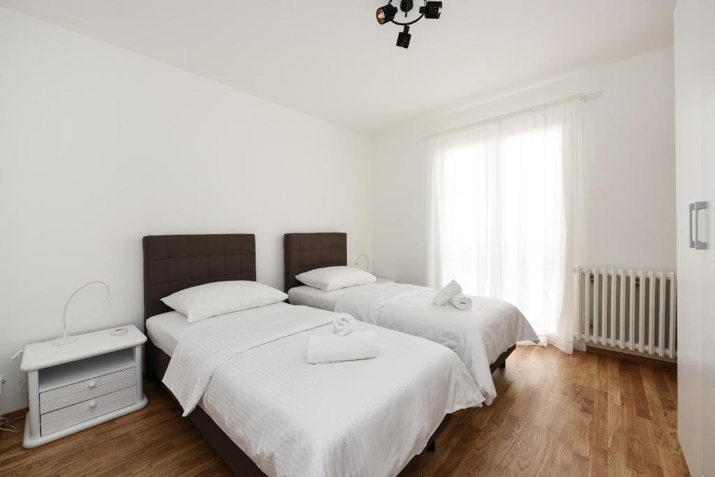 Posteľ alebo postele v izbe v ubytovaní July Apartment