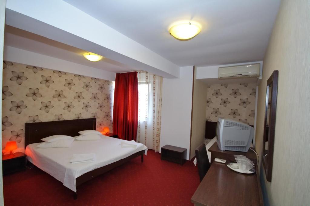 Postel nebo postele na pokoji v ubytování Hotel City