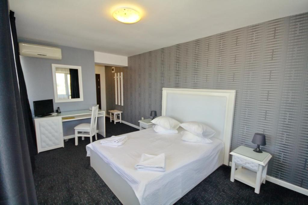 Postel nebo postele na pokoji v ubytování Hotel City