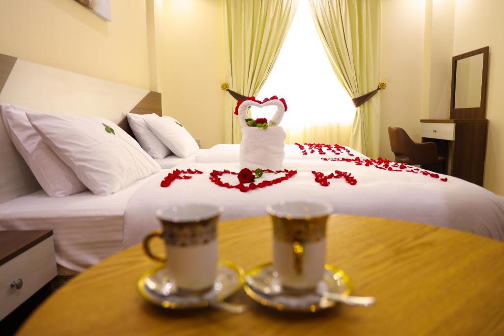 Postel nebo postele na pokoji v ubytování F & H Hotel