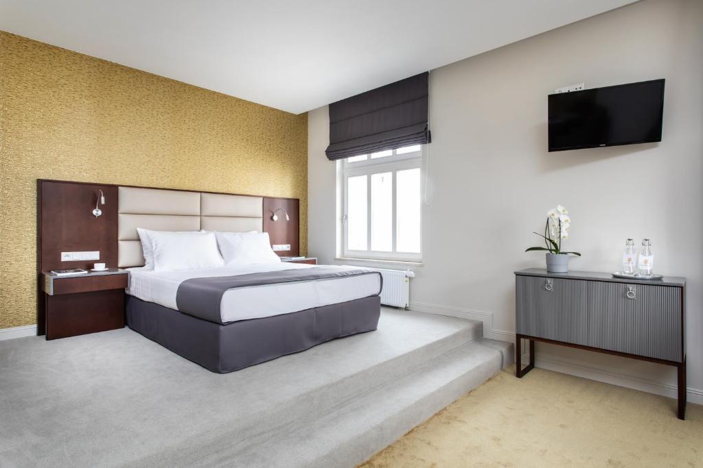 Postel nebo postele na pokoji v ubytování Jakubowy Hotel