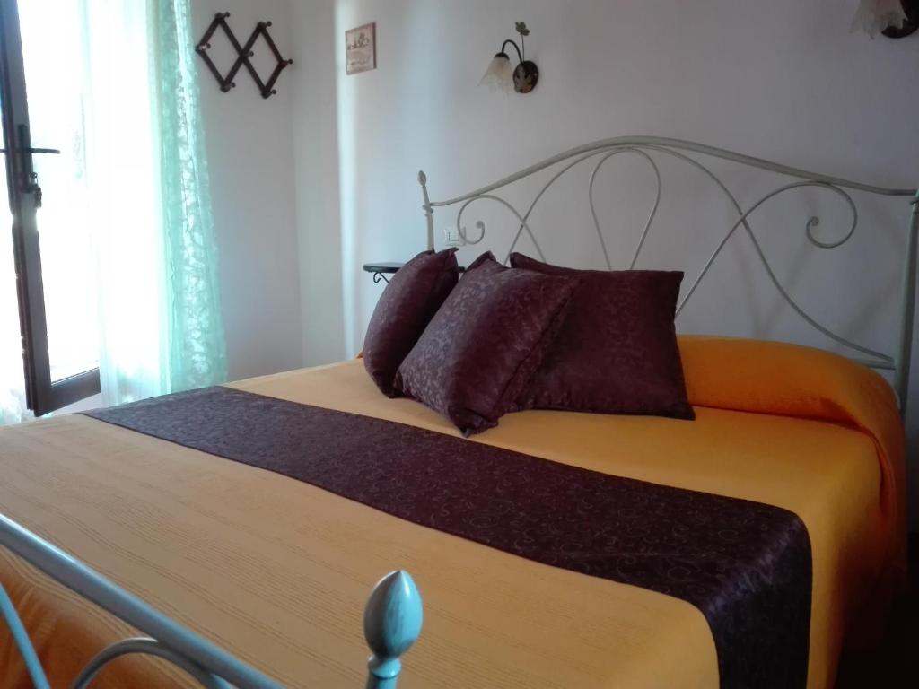 Postel nebo postele na pokoji v ubytování Il Vigneto B&B