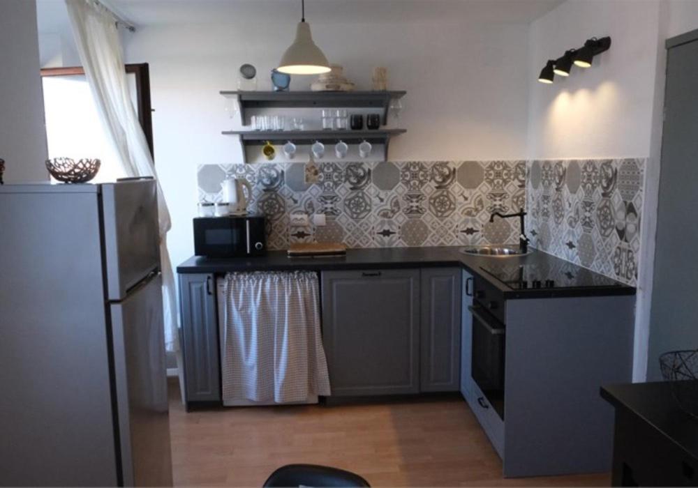 Kuchyň nebo kuchyňský kout v ubytování Apartments Jelena