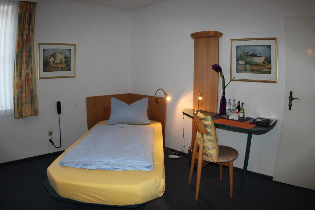 Postel nebo postele na pokoji v ubytování Hotel Stadt Munster