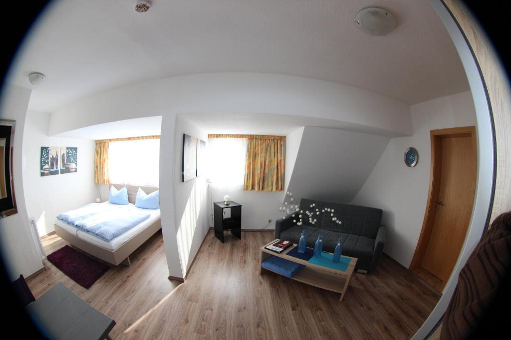 Postel nebo postele na pokoji v ubytování Hotel Stadt Munster