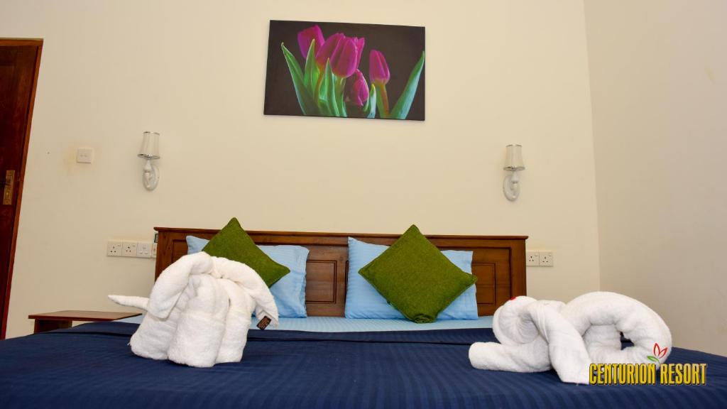 Postel nebo postele na pokoji v ubytování Centurion Resort