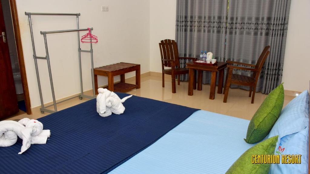 Postel nebo postele na pokoji v ubytování Centurion Resort