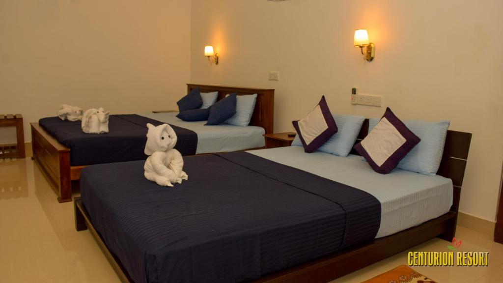 Postel nebo postele na pokoji v ubytování Centurion Resort