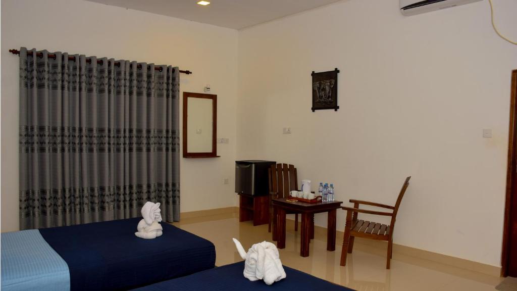 Postel nebo postele na pokoji v ubytování Centurion Resort