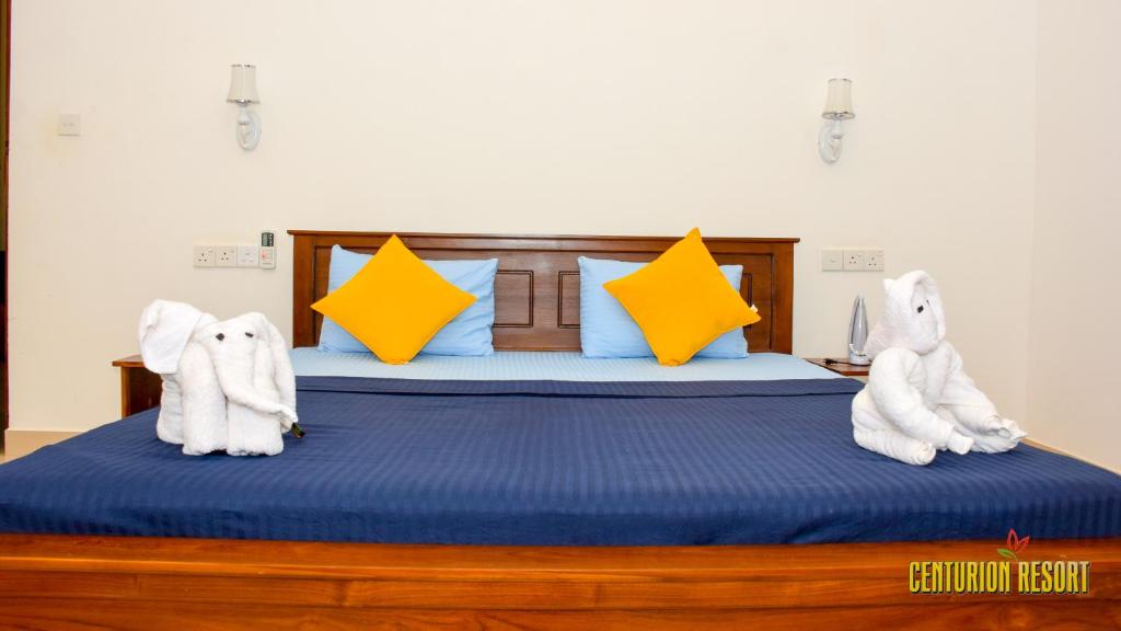 Postel nebo postele na pokoji v ubytování Centurion Resort