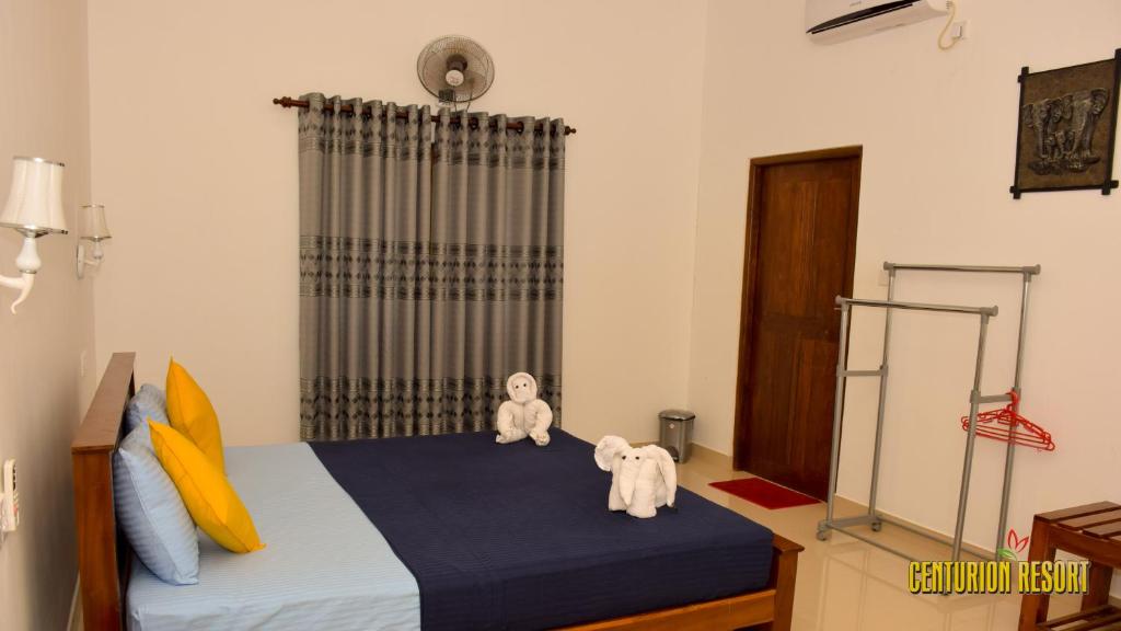 Postel nebo postele na pokoji v ubytování Centurion Resort