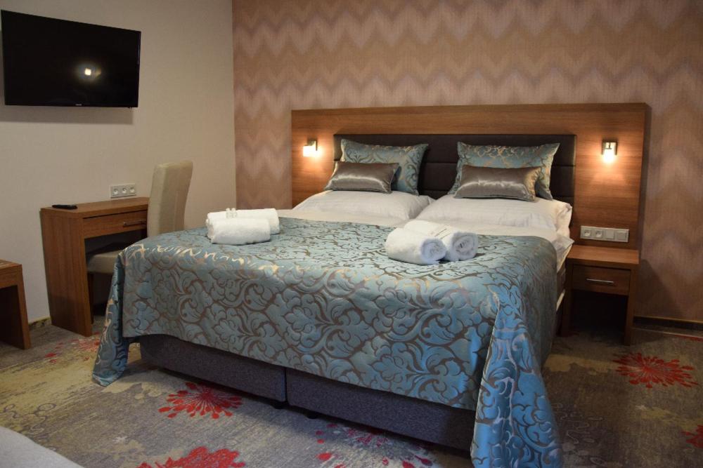 Postel nebo postele na pokoji v ubytování Hotel Prague Star