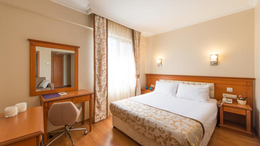Postel nebo postele na pokoji v ubytování Prestige Hotel Old City
