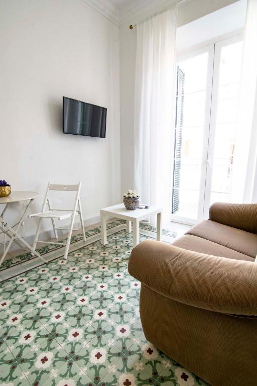 Televízia a/alebo spoločenská miestnosť v ubytovaní Letmalaga Economy Soho